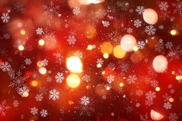 Christmas background with snow and bokeh lights