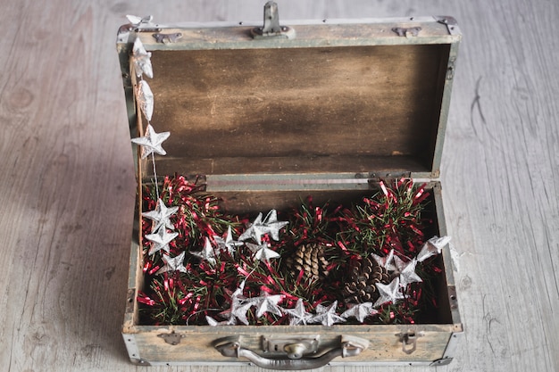 Free photo christmas background with wooden suitcase