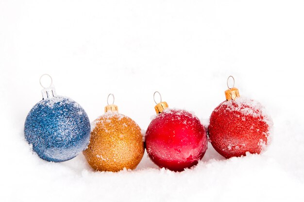 Christmas balls covered with snow