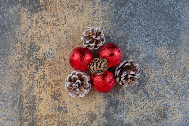 Christmas balls with Christmas pinecones on a dark background. High quality photo