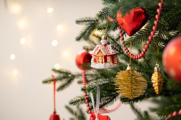 Christmas bauble on christmas tree with lights bokeh background