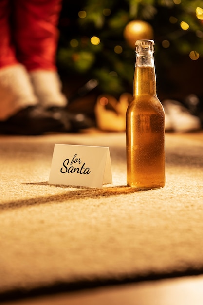 Free photo christmas beer bottle still life