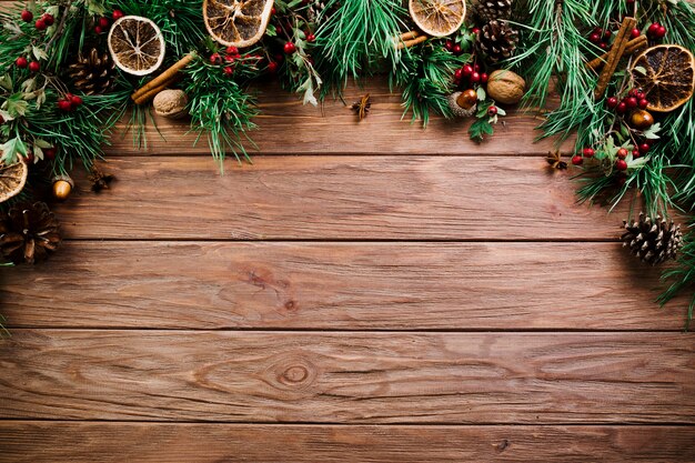 Christmas branch on wooden board