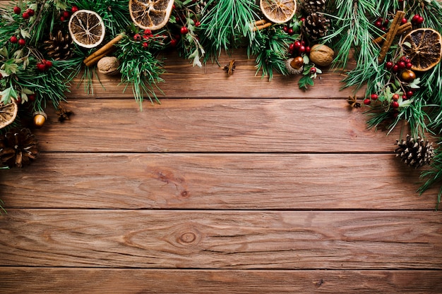 Christmas branch on wooden board