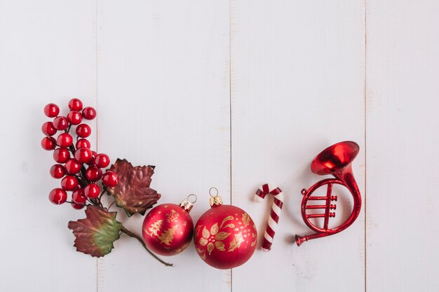 Christmas composition of baubles with berries 