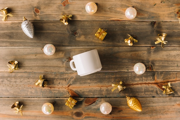 Christmas composition of cup with baubles 