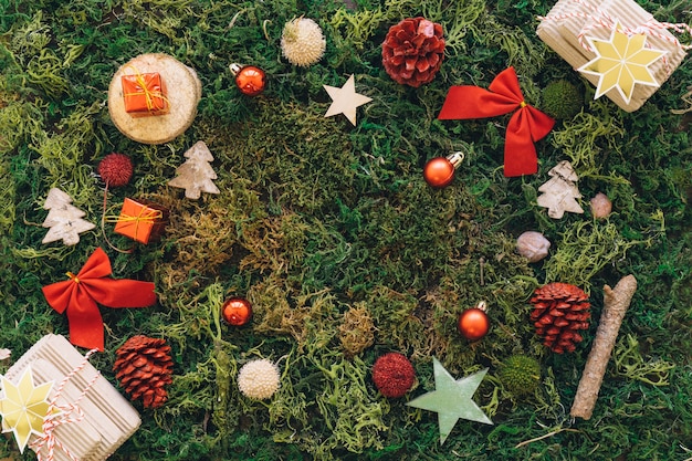 Christmas composition on grass with space in middle