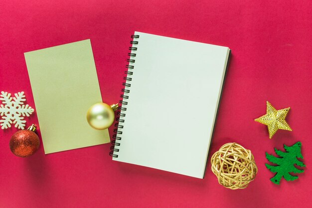 Christmas composition of notepad with small toys