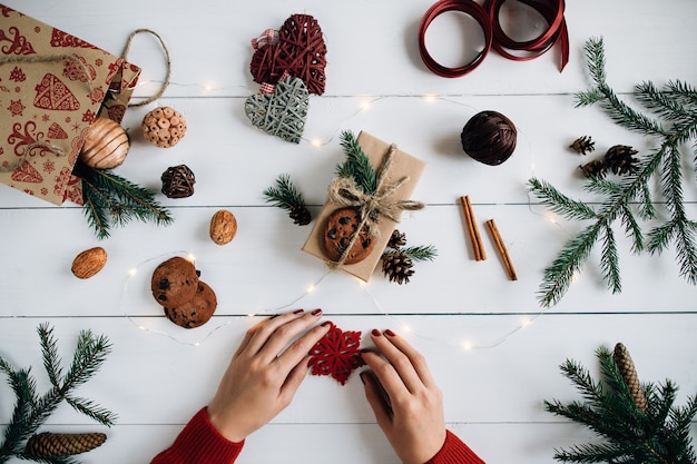 Christmas composition on white wooden table.