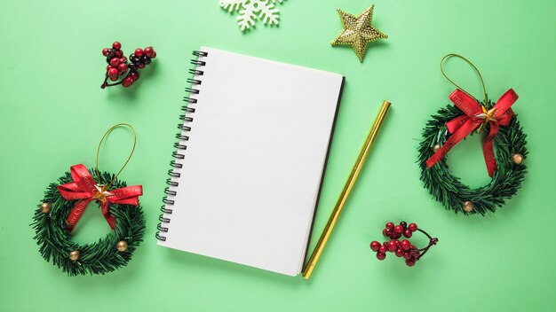 Christmas composition with blank notebook