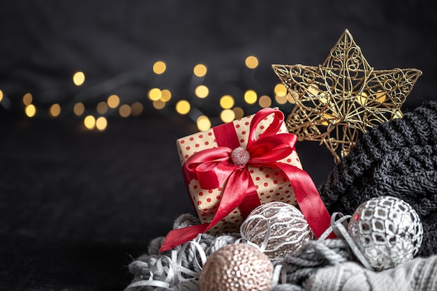 Christmas composition with a blurred dark background. Place for an inscription.