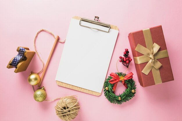 Christmas composition with clipboard and present box