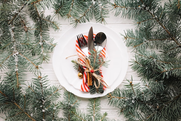 Christmas composition with cutlery on plate