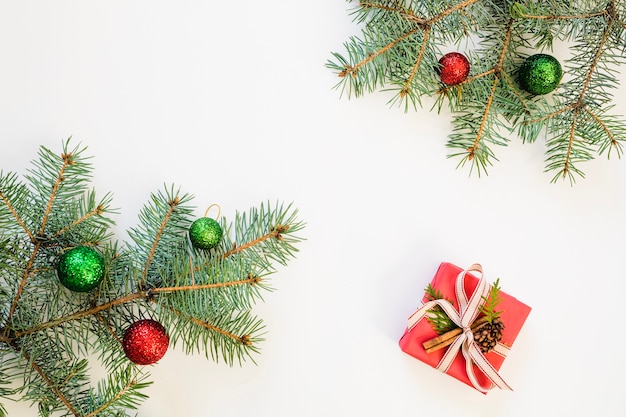 Christmas composition with fir branches and gift box