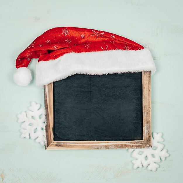 Christmas composition with hat on slate