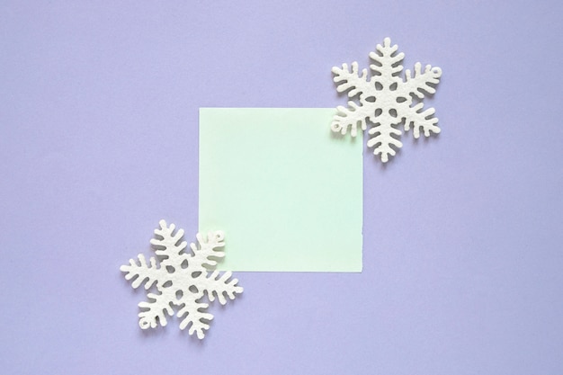 Christmas composition with post it and snowflake