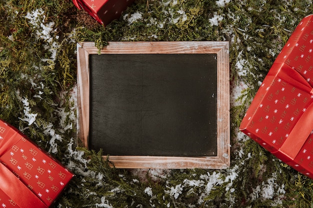 Christmas composition with slate and gifts