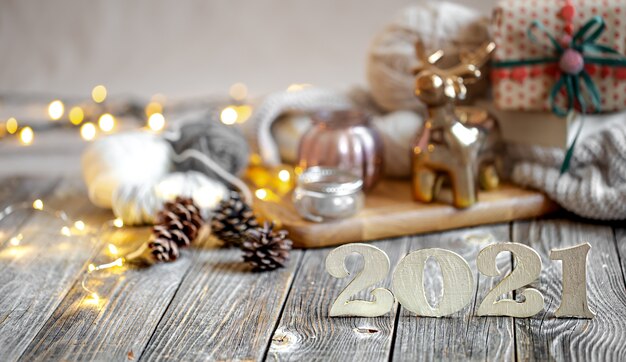 Christmas composition with wooden number for the coming year on the background of decor details.