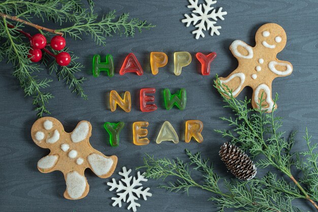 Christmas concept. Jelly and cookies with pine branches.