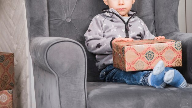 Christmas concept with kid and gift box