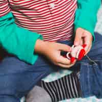 Free photo christmas concept with kid holding santa figure