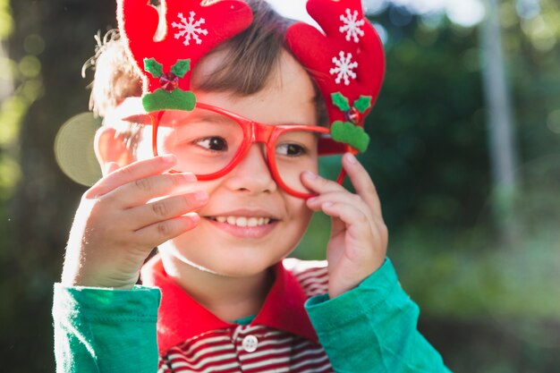 Christmas concept with kid wearing glasses