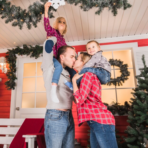 Christmas concept with parents kissing