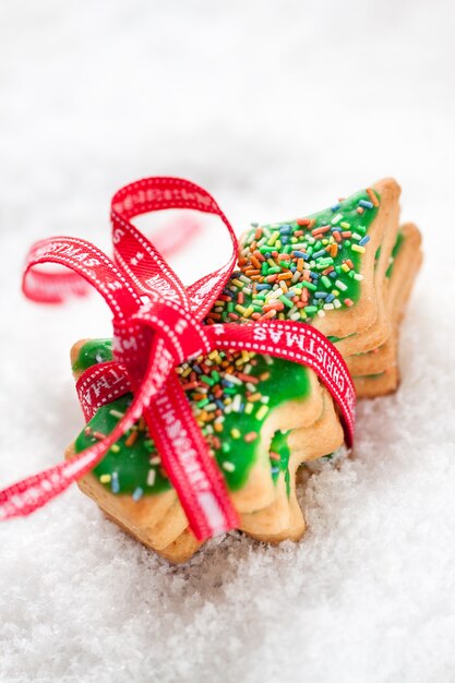 Free photo christmas cookies with red ribbon