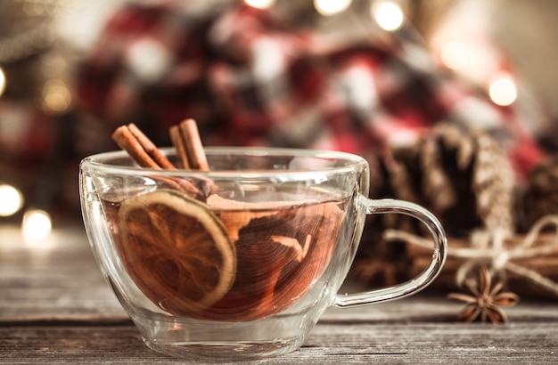 Free photo christmas cup with cinnamon and lemon