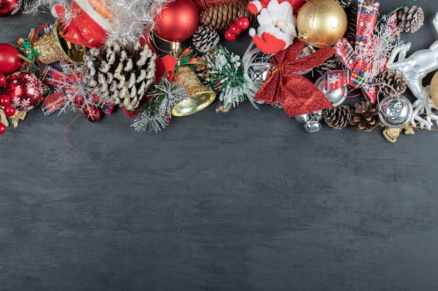 Christmas dark surface with ornaments and figurines