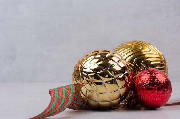 Christmas decoration balls with band on white background