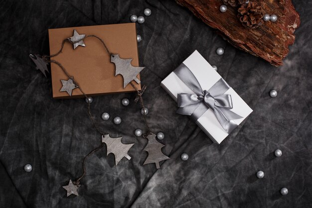 Christmas decoration and gift boxes over grey background. Above.