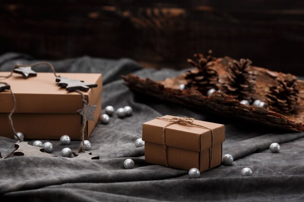 Christmas decoration and gift boxes over grey surface