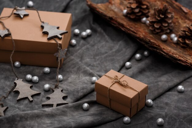 Christmas decoration and gift boxes over grey surface
