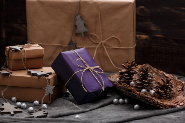 Christmas decoration and gift boxes over grey surface