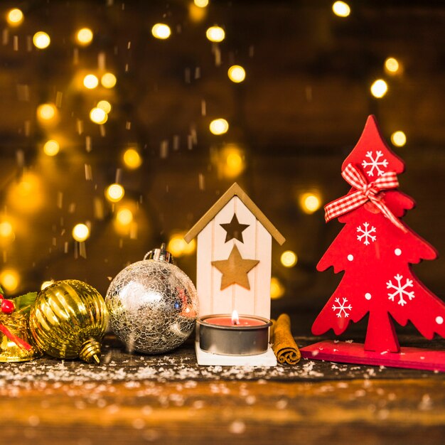 Christmas decoration between ornament snow near fairy lights