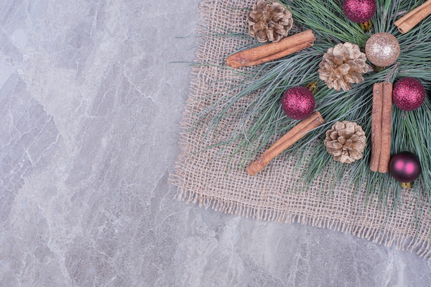 Christmas decoration with cinnamons, cones and oak tree branches