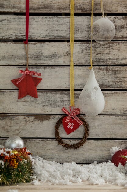 Free photo christmas decoration with fake snow and light bulbs