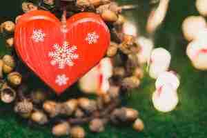 Free photo christmas decoration with nuts heart shaped box