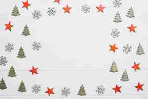 Free photo christmas decoration with trees, stars and space in middle