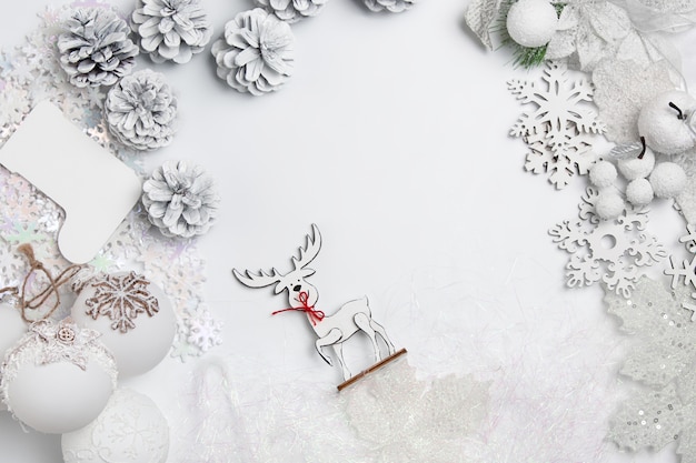 Christmas decorative composition of toys on a white table background.