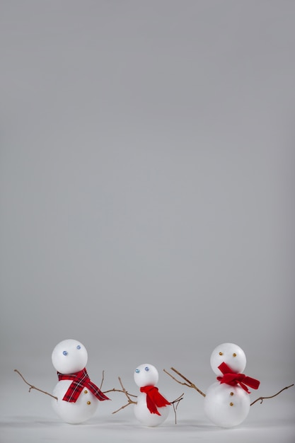 Free photo christmas dolls on a gray background