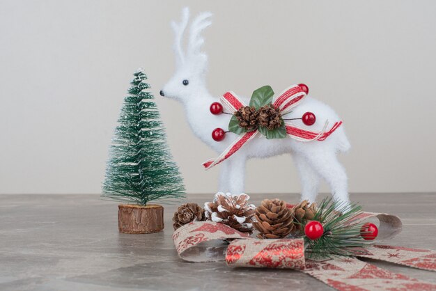 Christmas festive decorations on marble surface.