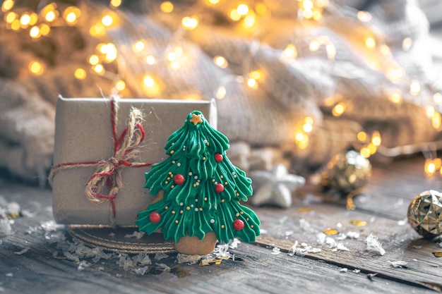 Christmas gift box and gingerbread on a blurred background