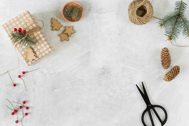 Christmas gift box with decoration on table 