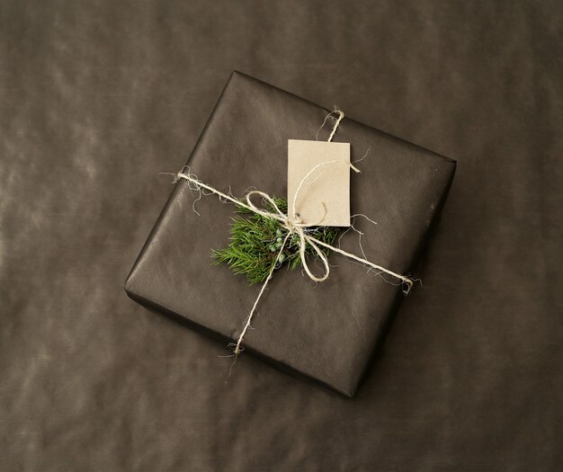 Christmas gift with black wrapped paper