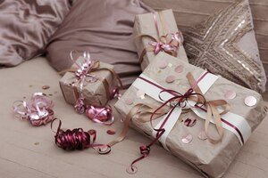 christmas gifts on the bed among the pillows, christmas gift wrapping concept.