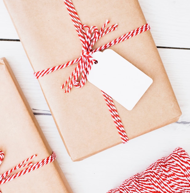 Christmas gifts wrapped with striped ribbon and card