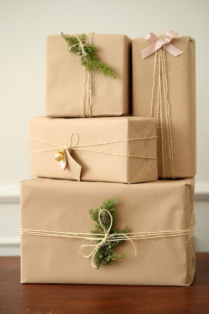 Christmas background with gift boxes and kraft wrapping paper Stock Photo  by OksaLy