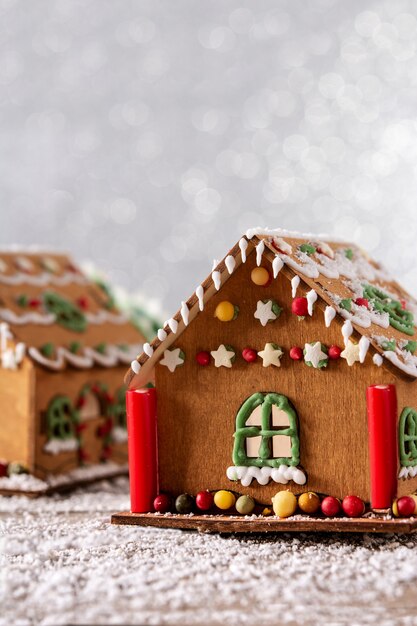Christmas gingerbread house on white glitter background